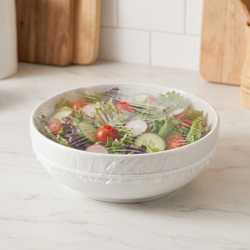 Charlottes élastiques Couvia sur un saladier de salade